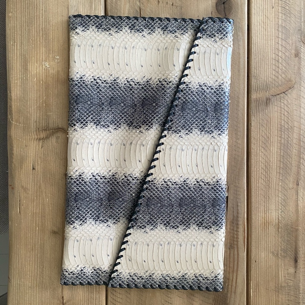 Stuart weitzman clutch 
IN FOR FALL 2025